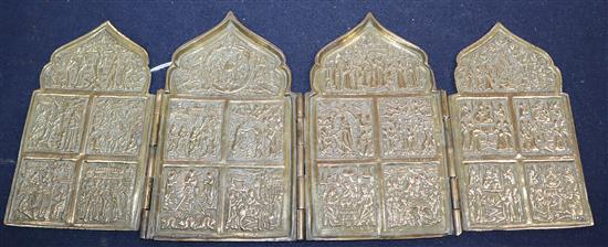A 19th century Russian cast brass tetraptych icon